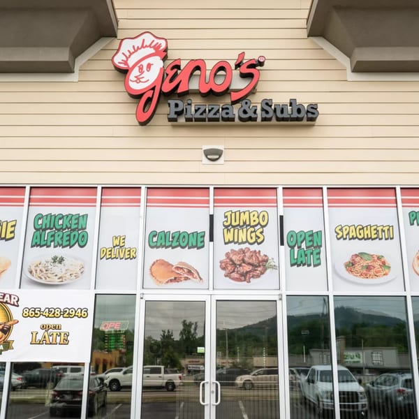 Geno's Pizza & Subs storefront with menu items like chicken alfredo, calzone, jumbo wings, and spaghetti displayed.