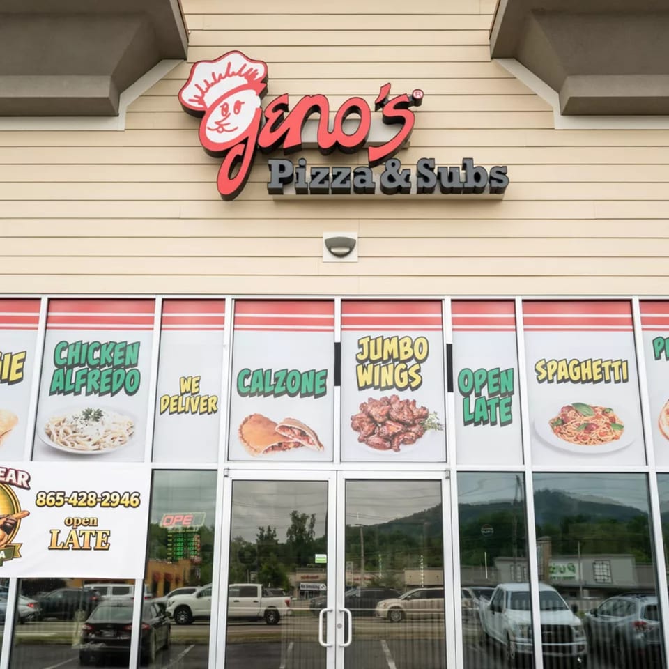 Geno's Pizza & Subs storefront with menu items like chicken alfredo, calzone, jumbo wings, and spaghetti displayed.