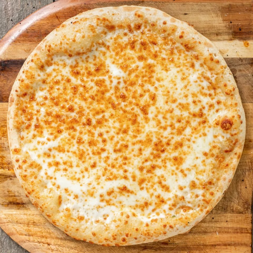 A round, golden-crusted cheese pizza with melted white and browned cheese on a wooden board.